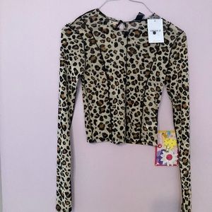 Brand New with a tag. A tan/black top with full sleeves. Small Size.